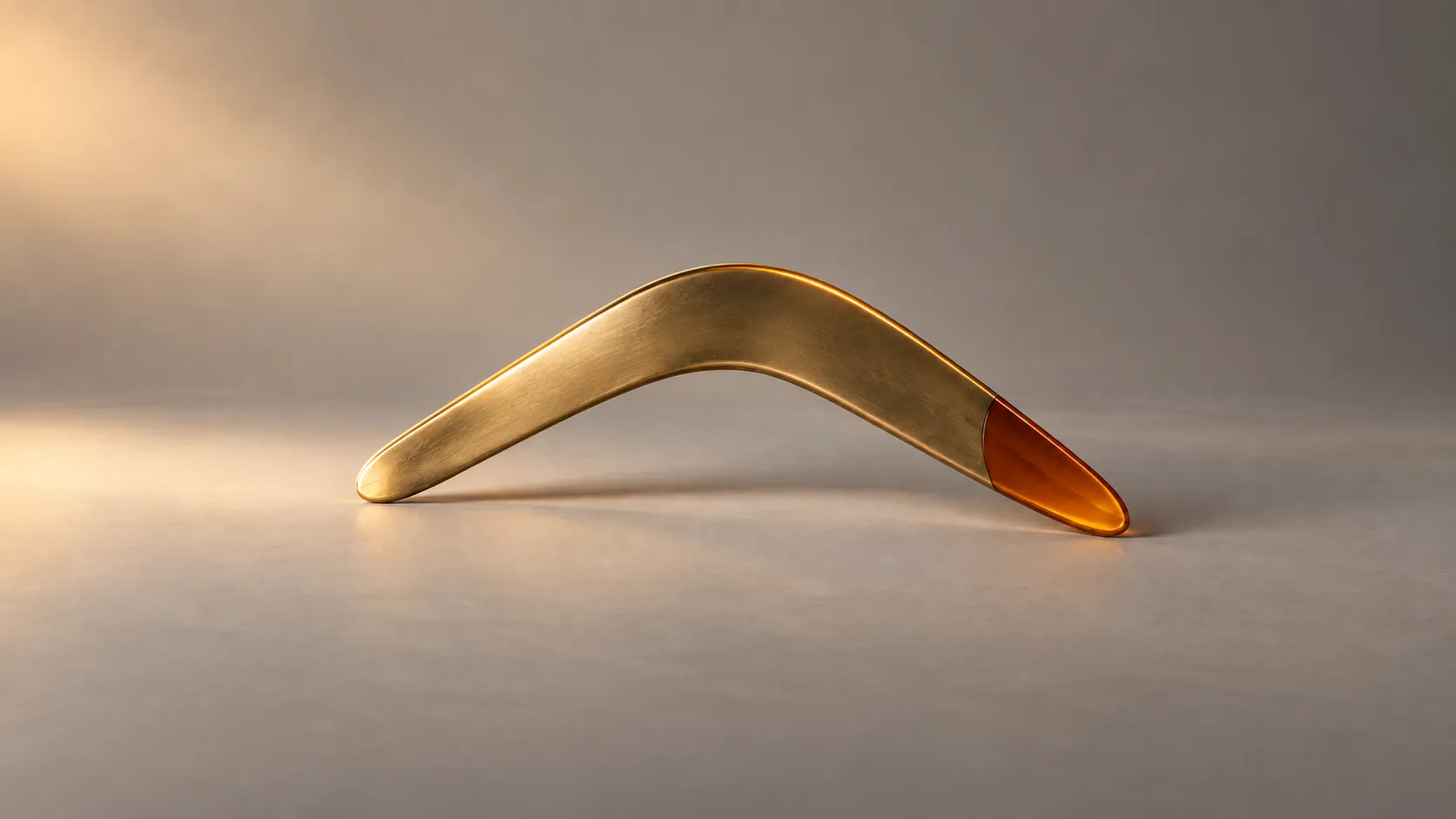 Brushed brass boomerang with an amber tip for remarketing explained