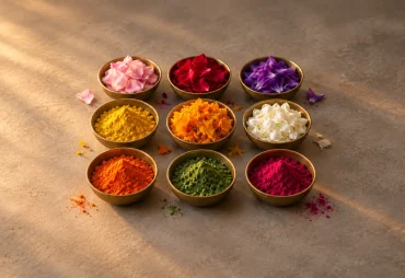 Colourful flower petals and pigments in brass bowls for Navratri