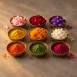 Colourful flower petals and pigments in brass bowls for Navratri